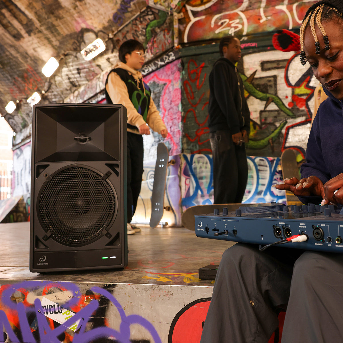 AlphaTheta WAVE-EIGHT speaker powering a DJ set at a street venue