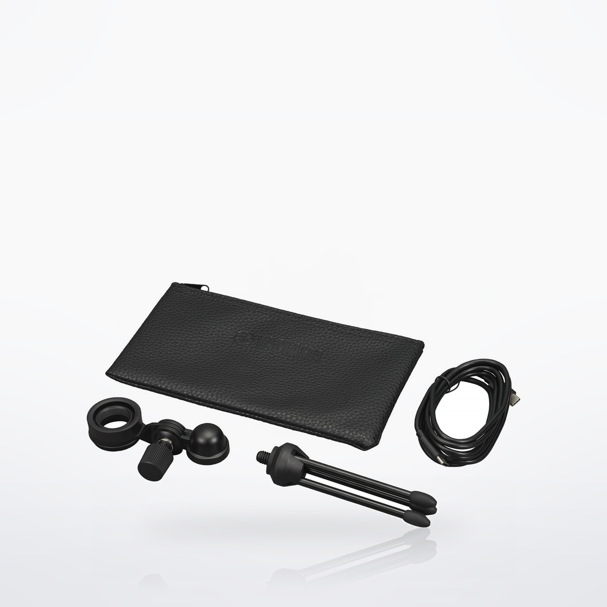 Yamaha YCM01U included accessories: desk tripod, stand adapter, USB-C cable and pouch